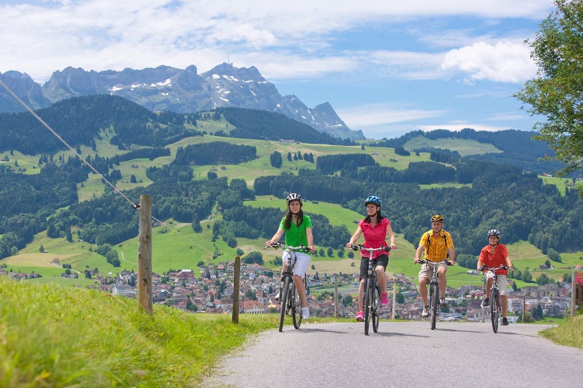 Four people on e-bikes near Appenzell
