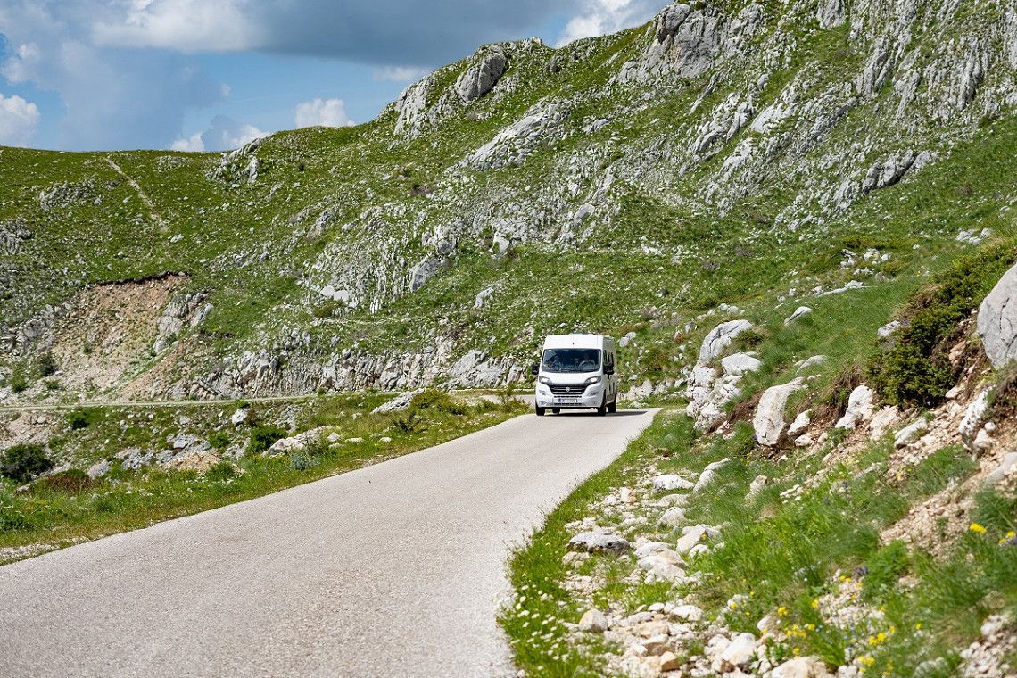 A campervan on the panoramic road Durmitor Ring