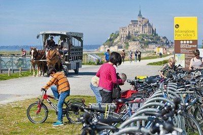 Bicycle parking and horse-drawn carriage at Mont-Saint-Michel