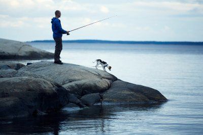 Fishing along with a dog in Sweden