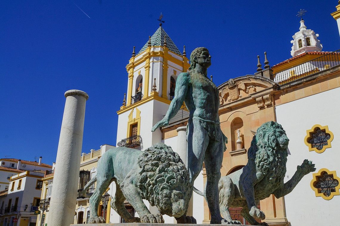 Church and statues at Plaza del Socorro in Ronda