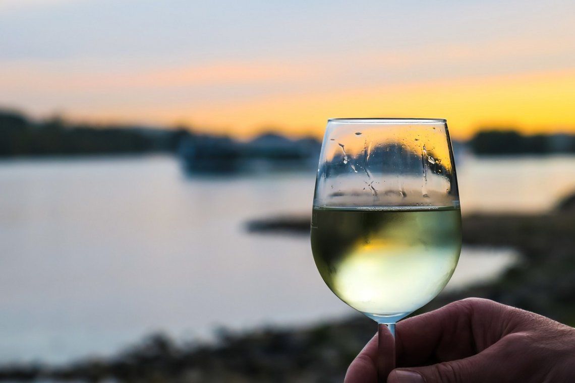 White wine by the sea at sunset