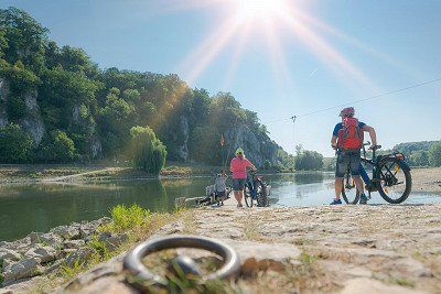 Cyclists waiting for the cable ferry to take them across the Danube