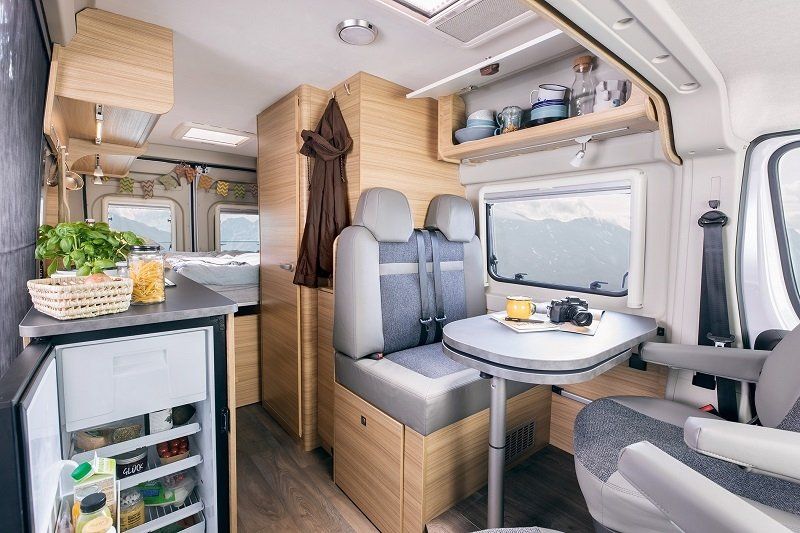 A Sunlight campervan interior with open cabinets