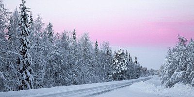 Snowy road in winter in Lapland, Finland