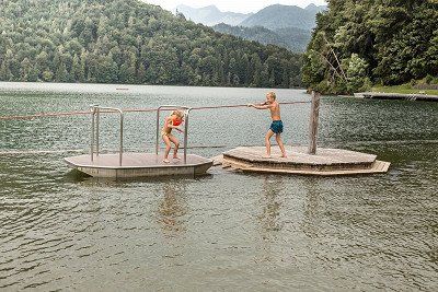 Children playing on swiming islands in the Hechtseee