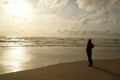 Man on Zandvoort beach at sunset