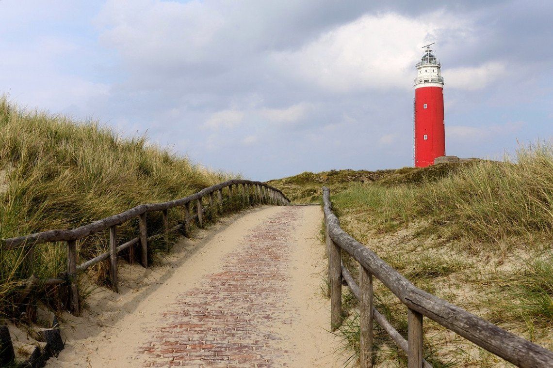 The lighthouse in Texel above the dunes